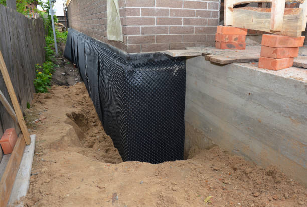 Happy homeowners after waterproofing job in Blanchard